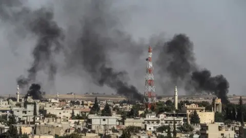 EPA Smoke rises from inside Syria during bombardment by Turkish forces