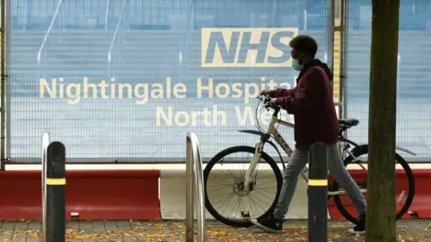 Getty Images A man cycles a bike in the north west