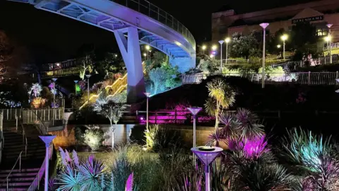 LuminoCity Light installation at night amongst trees