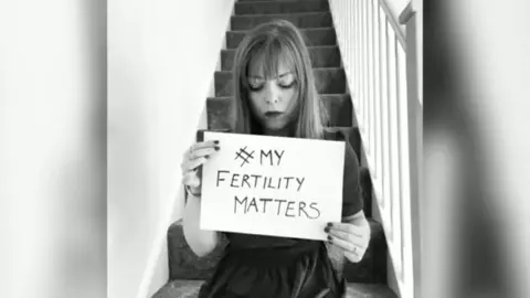 Sarah Barkerr Sarah Barker holding a sign saying my fertility matters