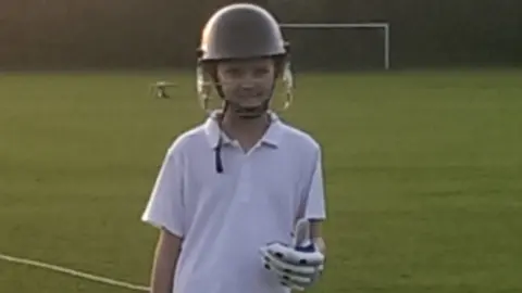 Family handout Leo playing cricket
