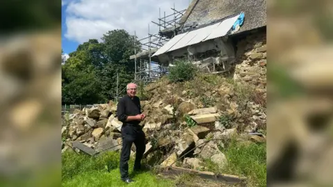 BBC/Lizzie Musham The Reverend Charles Patrick outside St John the Baptist, in High Toynton, near Horncastle,