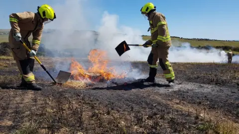 IOM FIRE AND RESCUE SERVICE A fire crew tackling to fire