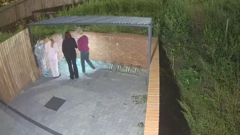 RSPCA Three women and Reegan Smith looking at the pigeon