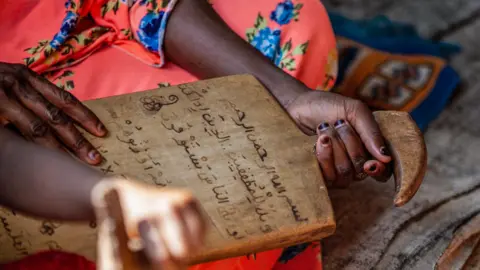 Getty Images Pupils holding a school board at a Muslim school in the Central African Republic