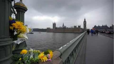 Flowers and candles on Westminster Bridge