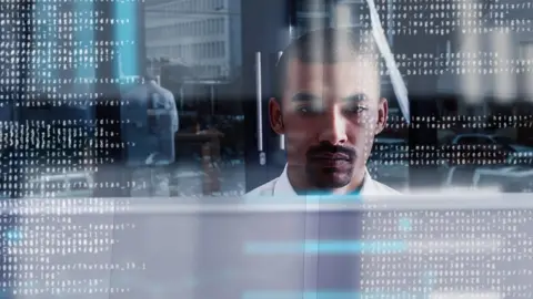 Getty Images Office worker at computer