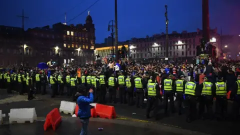 Getty Images Police containing crowd at George Square