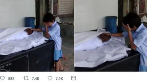 Shiv Sunny This photo of the worker's 11-year-old son sobbing next to his body went viral.