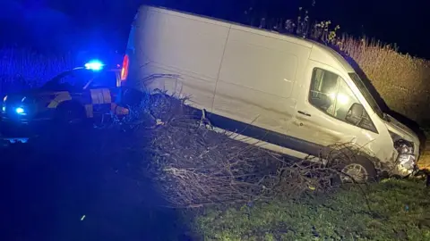 P S Watkins A van in a ditch