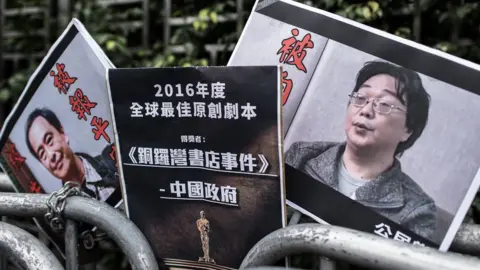 PHILIPPE LOPEZ/AFP/Getty Images Placards showing missing bookseller Gui Minhai (R) and his associate Lee Bo, pictured in Hong Kong in 2016