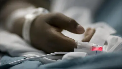 Getty Images Patients in hospital bed