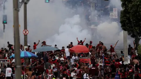 Tear gas is fired during the Flamengo victory Parade - Rio de Janeiro, Brazil - November 24, 2019