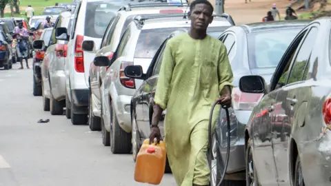 Getty Images Motorists queue to buy fuel in Abuja, Nigeria - 30 May 2023