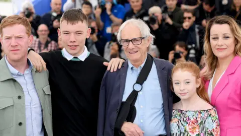 Getty Images Ken Loach and (l-r) Sorry We Missed You stars Kris Hitchen, Rhys Stone, Katie Proctor and Debbie Honeywood