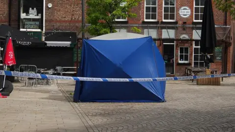 PA Media Police tent at the scene on Railway Street in Altrincham