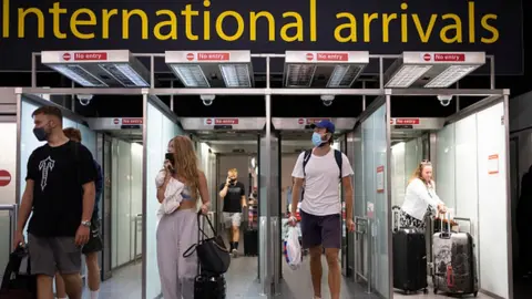 Getty Images People arriving at Gatwick Airport