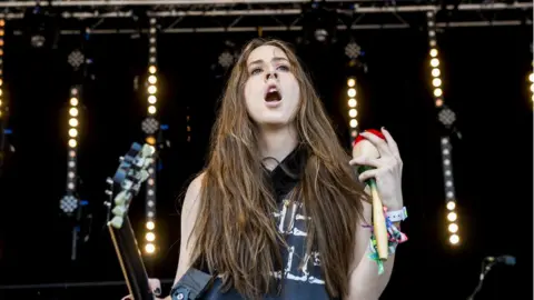 Alana Haim on stage at Glastonbury