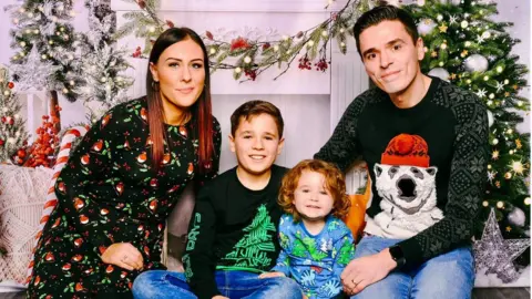 Katie Berrill Katie plus family in Christmas outfits