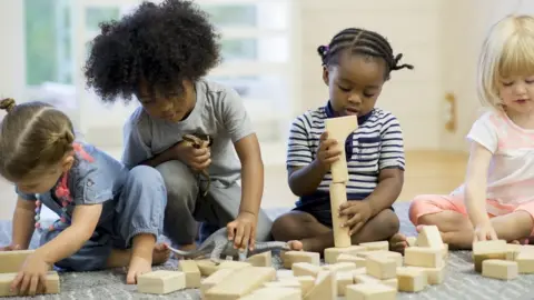 Getty Images toddlers with bricks