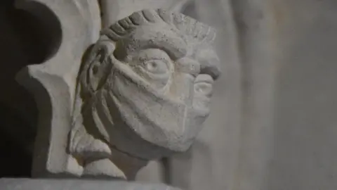 St Albans Cathedral Face with a face-mask on