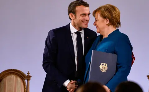 Getty Images German Chancellor Angela Merkel and French President Emmanuel Macron sign the Aachen Treaty on January 22, 2019