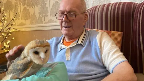 AgeCare A care home resident strokes Bonzo