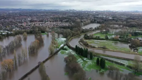 PA Media Aerial view showing flooding in the Didsbury area of Manchester after Storm Christoph