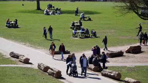 PA Media People in the grounds at Wollaton Hall, Nottingham on 29 March 2021