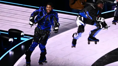 Getty Images US singer-songwriter Usher performs during Apple Music halftime show of Super Bowl LVIII between the Kansas City Chiefs and the San Francisco 49ers at Allegiant Stadium in Las Vegas, Nevada, February 11, 2024