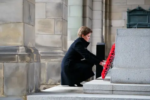PA Media Nicola Sturgeon laying a wreath