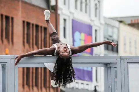 Stockton International Riverside Festival A performer from the Alleyne Dance company