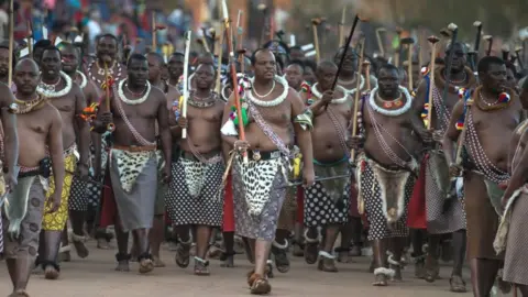 AFP King Mswati III of Swaziland (C) arrives at the annual royal Reed Dance at the Ludzidzini Royal palace on August 28, 2016 in Lobamba, Swaziland