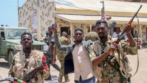 Getty Images Sudanese army soldiers in Khartoum last week