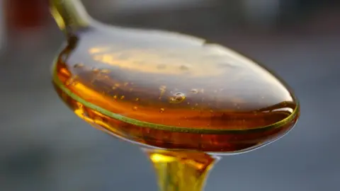 Getty Images Spoon of honey