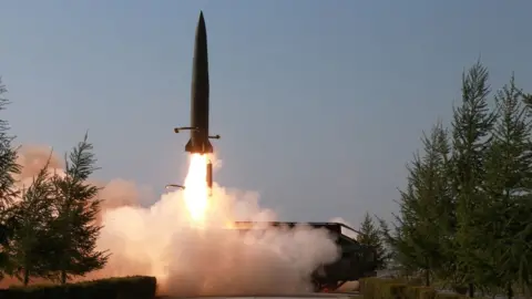 Reuters A missile is seen launched during a military drill in North Korea