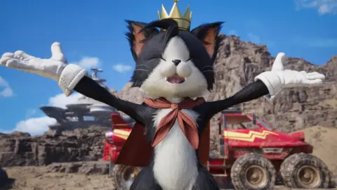 A humanoid black and white cat wearing a small gold crown and with a red cravat tied around its neck. Its arms are spread out to its sides, white-gloved palms upturned and its eyes are closed as it grins, suggesting a celebratoy mood. Behind it is a four wheel drive vehicle and sand dunes