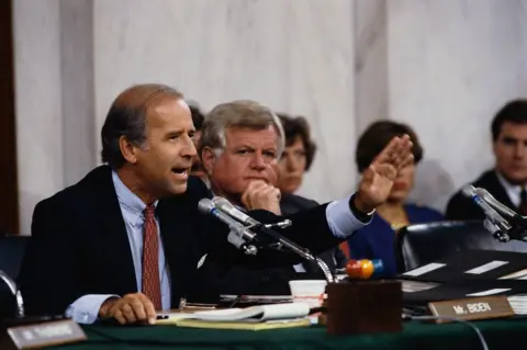 Wally McNamee/ Getty Images Senators Joseph Biden and Ted Kennedy attend the Clarence Thomas confirmation hearings