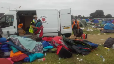 Volunteers collecting sleeping bags