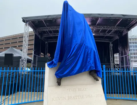 Stuart Howells/BBC Statue of Kevin Beattie covered up