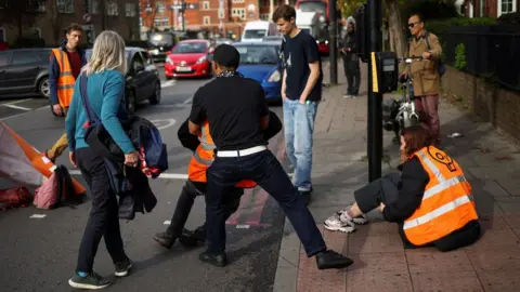 Reuters/Henry Nicholls Just Stop Oil demonstrators