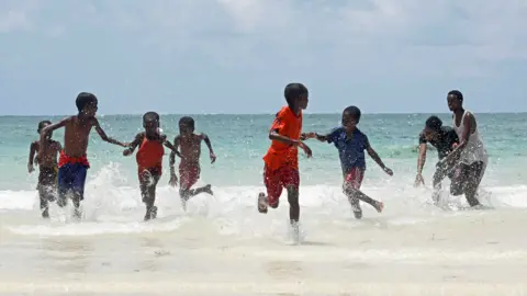 Reuters Children play on a beach in Mogadishu, Somalia - Friday 3 April 2020