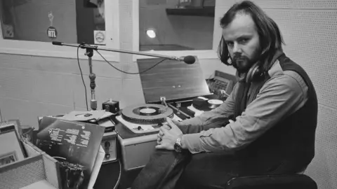 Getty Images John Peel pictured presenting on Radio 1 in 1972