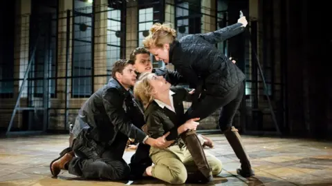 Helen Maybanks Sean Hart as Demetrius, Luke MacGregor as Chiron, Hannah Morrish as Lavinia and Nia Gwynne as Tamora