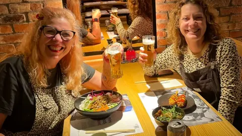 Kazzy Minton Kazzy and Di Coke in a restaurant