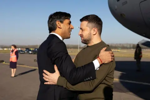 Simon Dawson / No 10 Downing Street  Prime Minister Rishi Sunak greets Volodymyr Zelensky, president of Ukraine as he arrives in the United Kingdom.