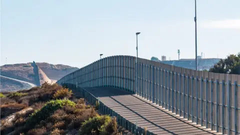 Getty Images A section of the border wall between San Diego, California and Tijuana, Mexico