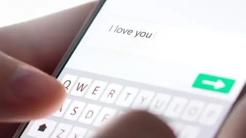 Getty Images Phone with 'I love you' message