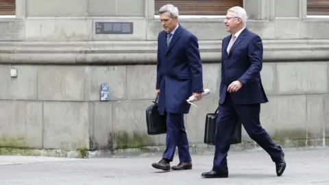 EPA Vice Chairman of the Board of Directors UBS Group AG Lukas Gaehwiler (L) and Member of the Group Executive Board of UBS Group AG Markus Ronner (R) walk in front of the Bernerhof, headquarters of the Swiss Federal Department of Finance FDF, in Bern, Switzerland