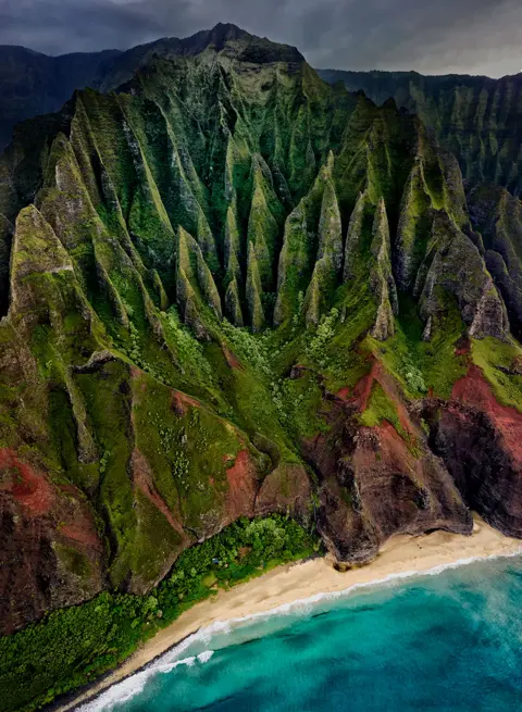 Stuart Chape An aerial view of a mountainous coast in Kauai Island, Hawaii, US